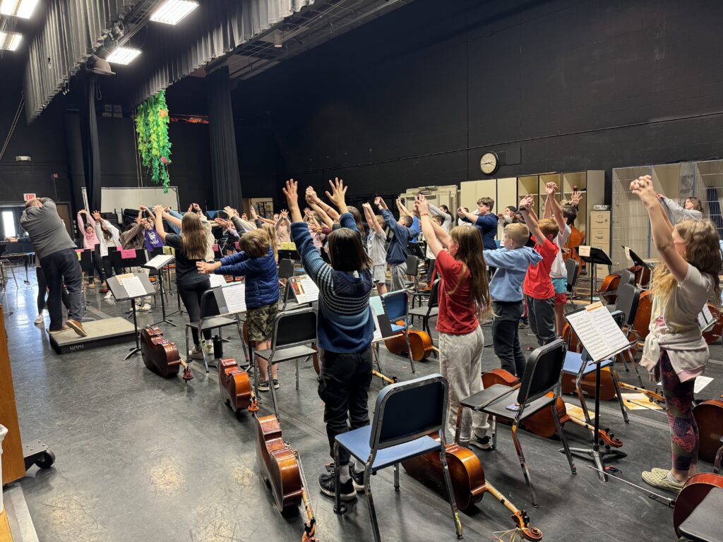 Station Orchestra Students practicing orchestra yoga