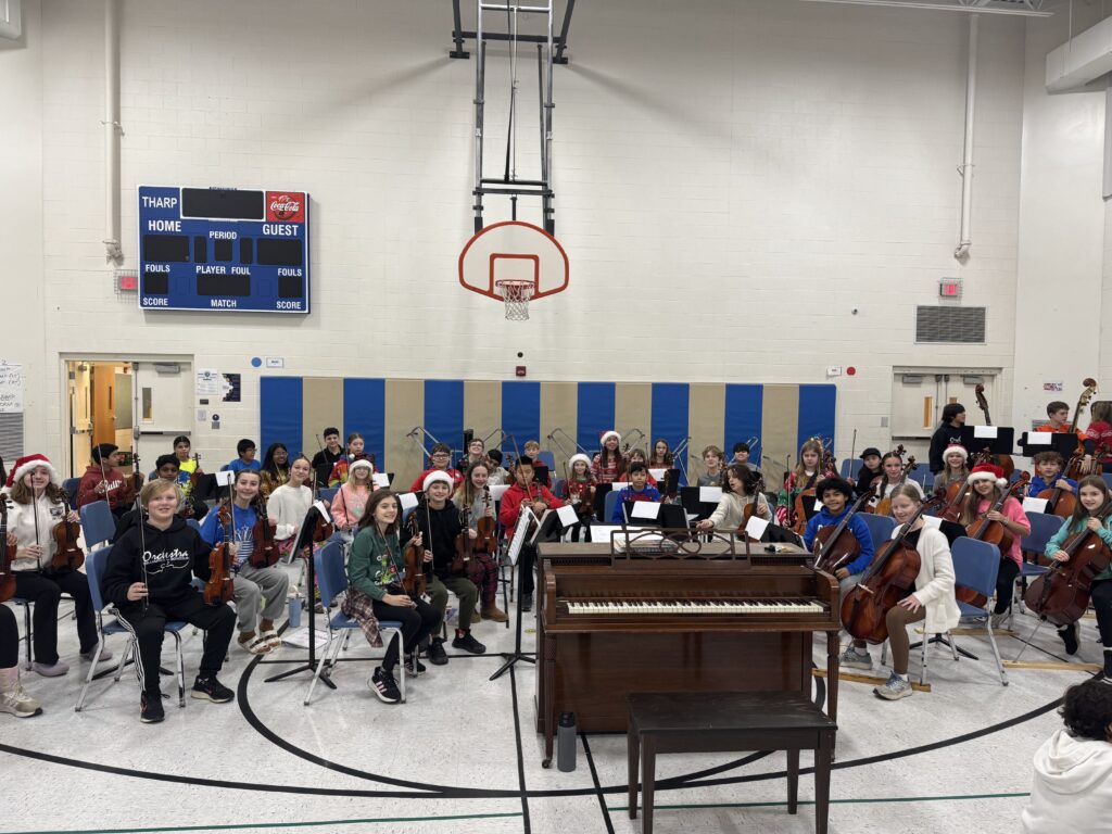 Tharp Orchestra performing in the Tharp gymnasium