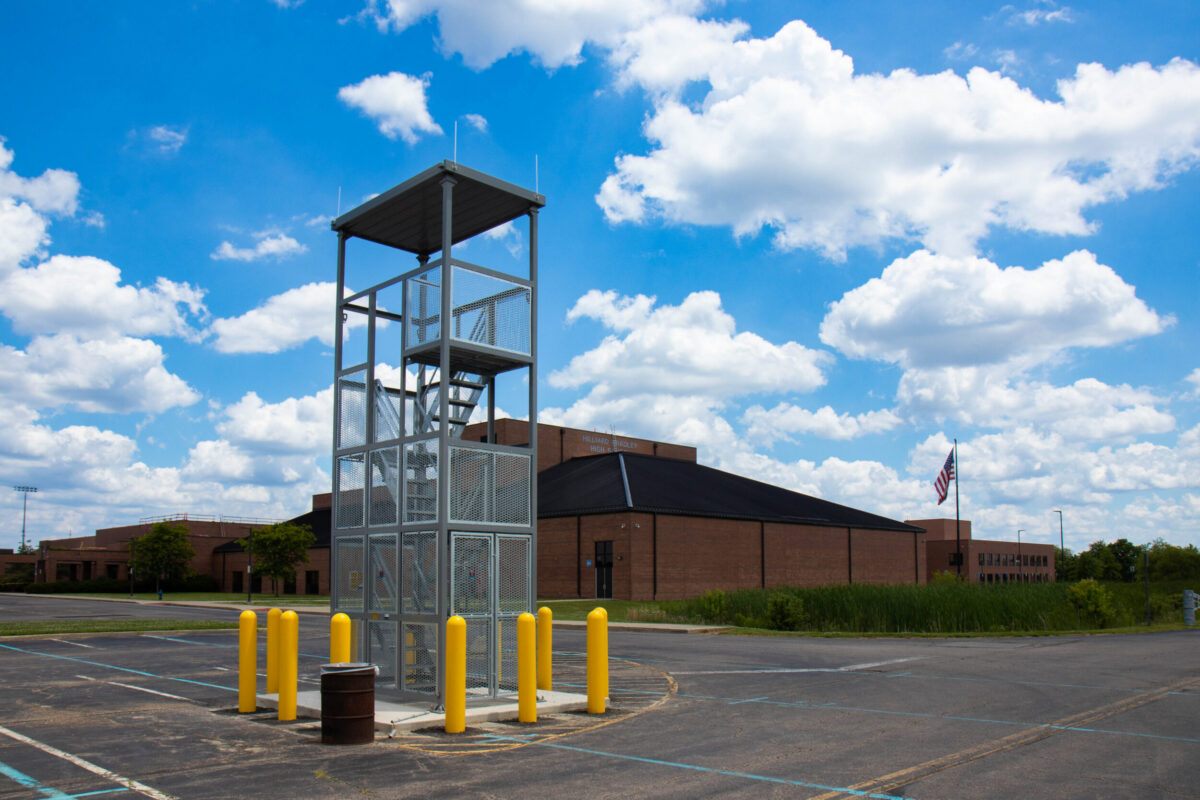 
Band tower with school behind it