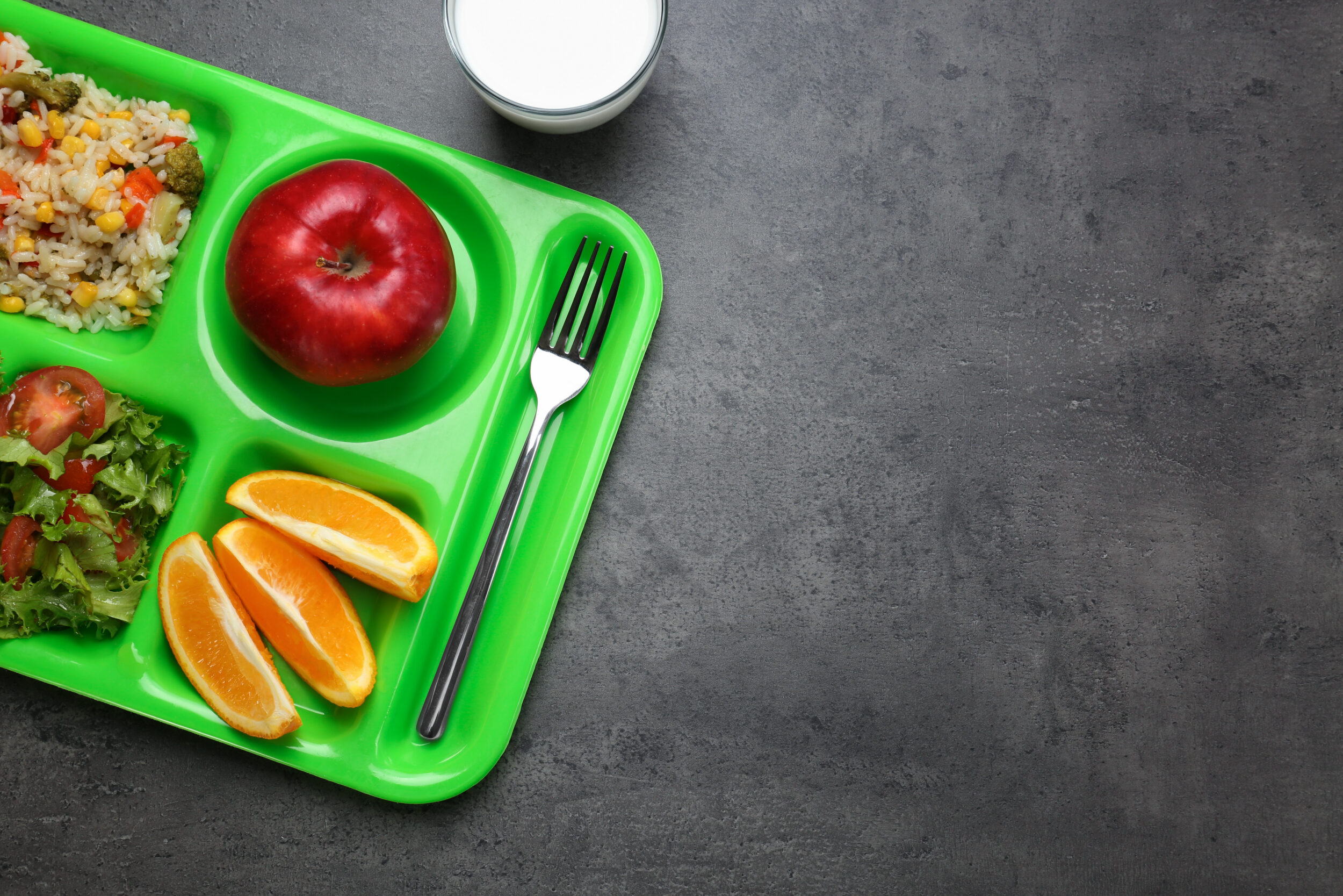 Serving tray with food on table.