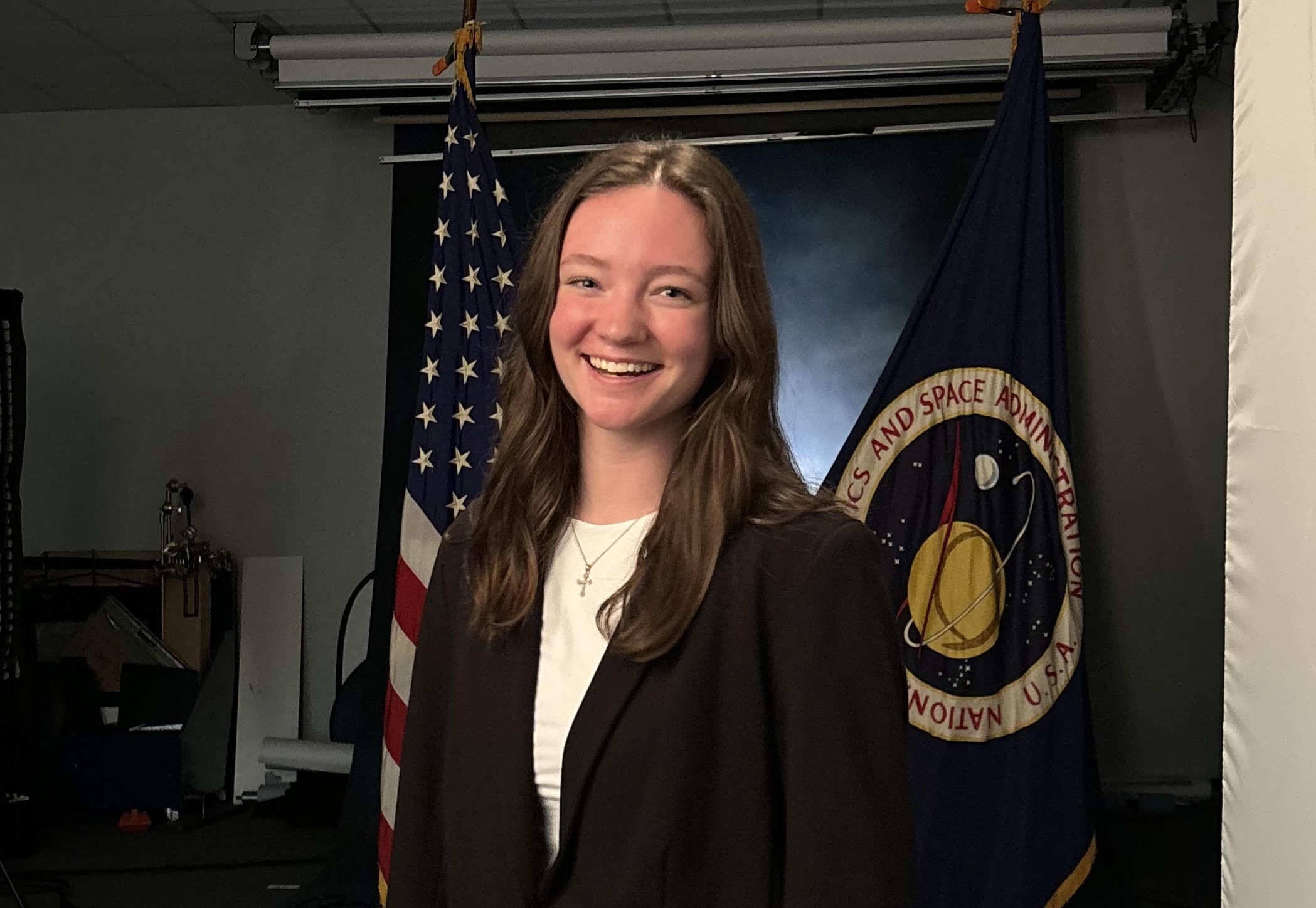 Woman smiling with suit on