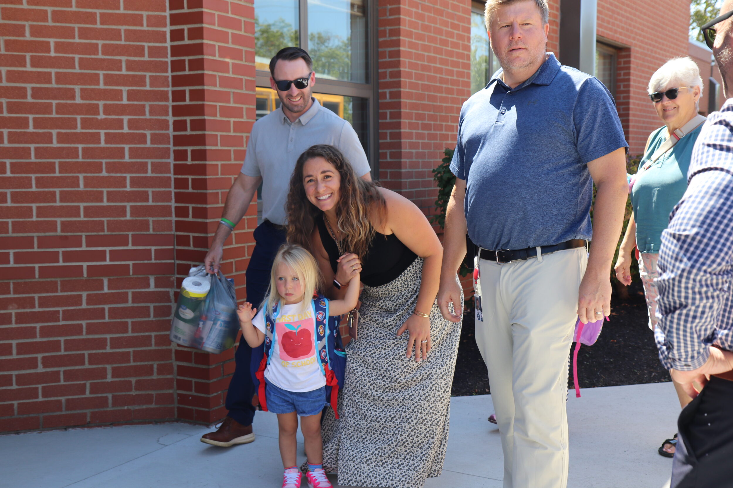 First day of school picture walking into building